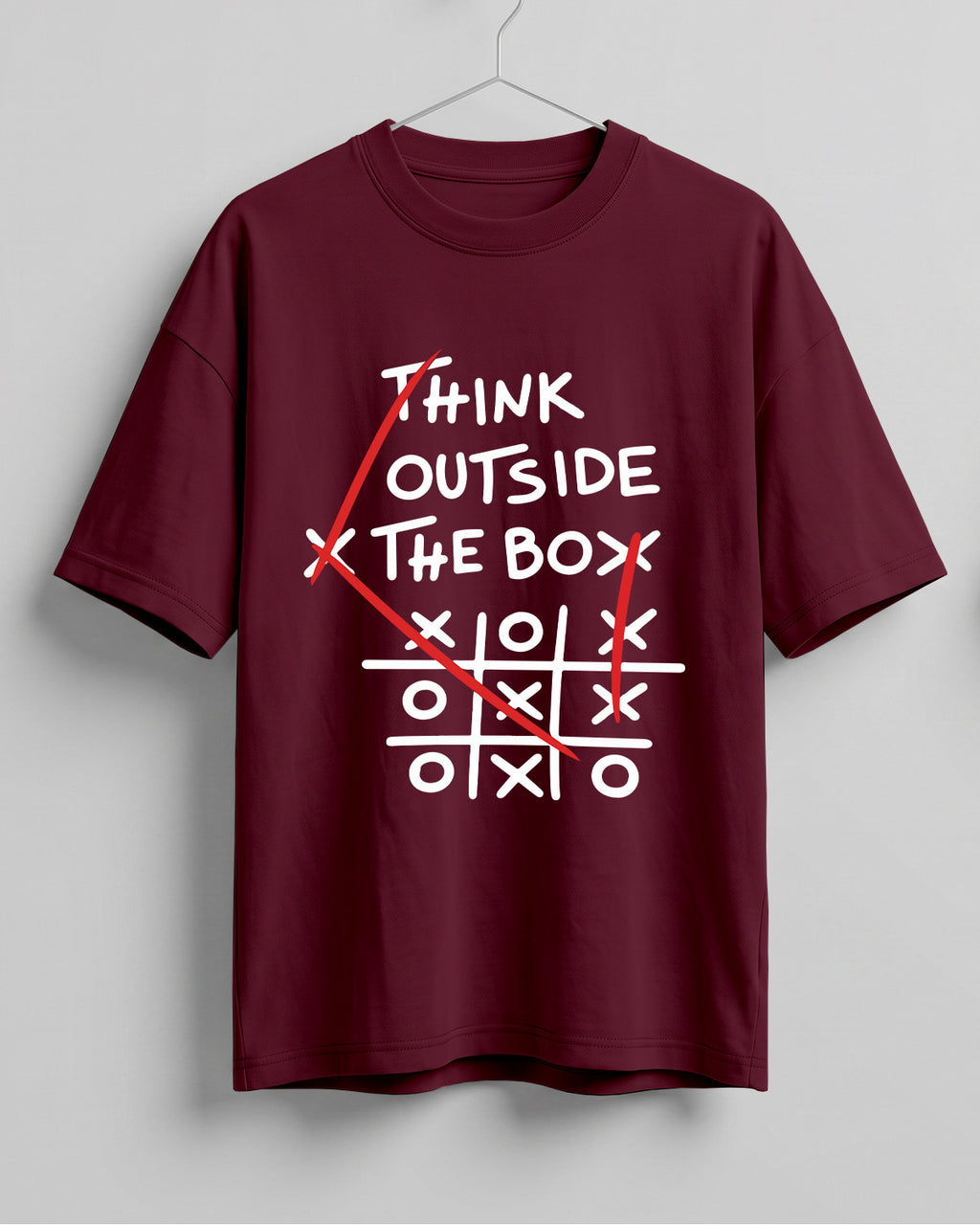 Graphic half sleeve oversized t-shirt featuring Think Outside the Box quote with tic-tac-toe graphic on cotton fabric