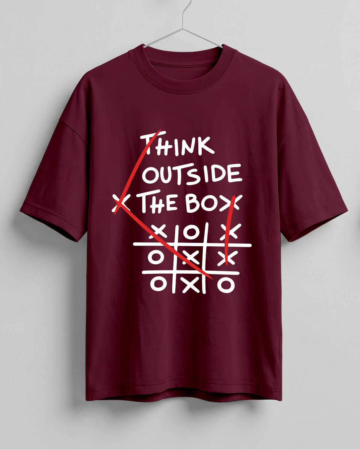Graphic half sleeve oversized t-shirt featuring Think Outside the Box quote with tic-tac-toe graphic on cotton fabric