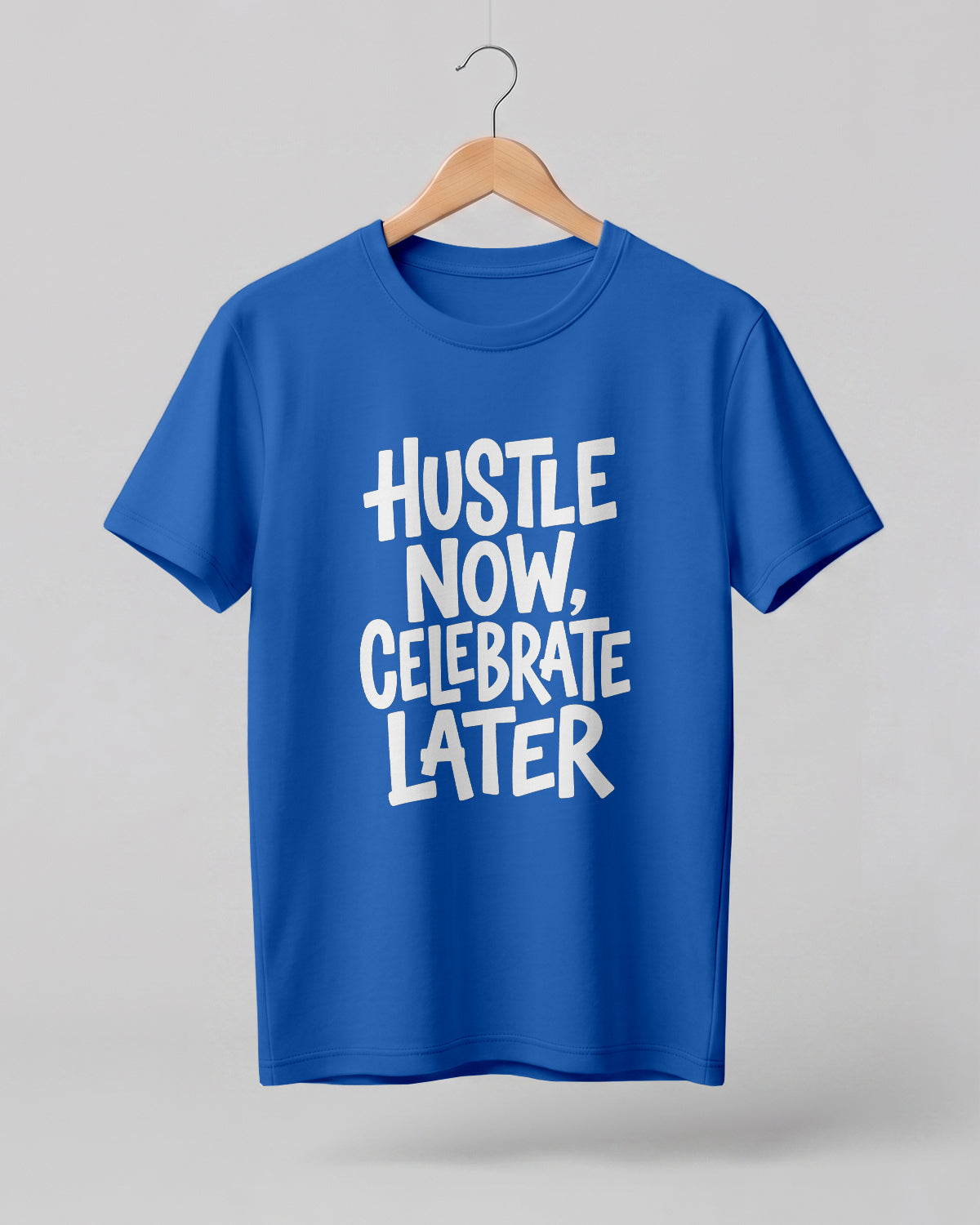 Motivational quote graphic half sleeve t-shirt featuring Hustle Now Celebrate Later typography design on premium cotton fabric