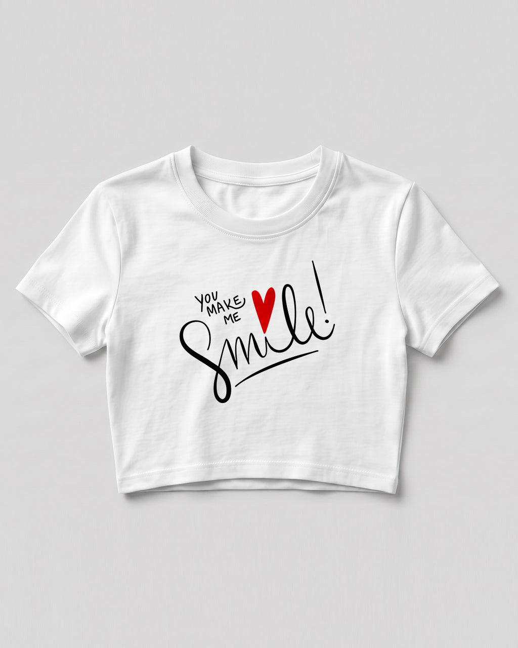 Motivational graphic crop top featuring You Make Me Smile typography design with heart graphic on cotton fabric