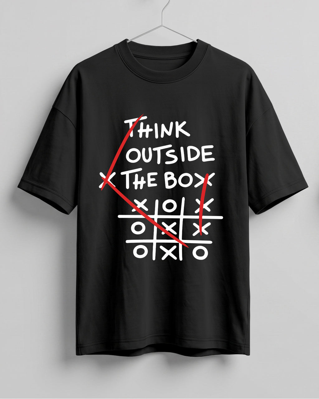 Graphic half sleeve oversized t-shirt featuring Think Outside the Box quote with tic-tac-toe graphic on cotton fabric