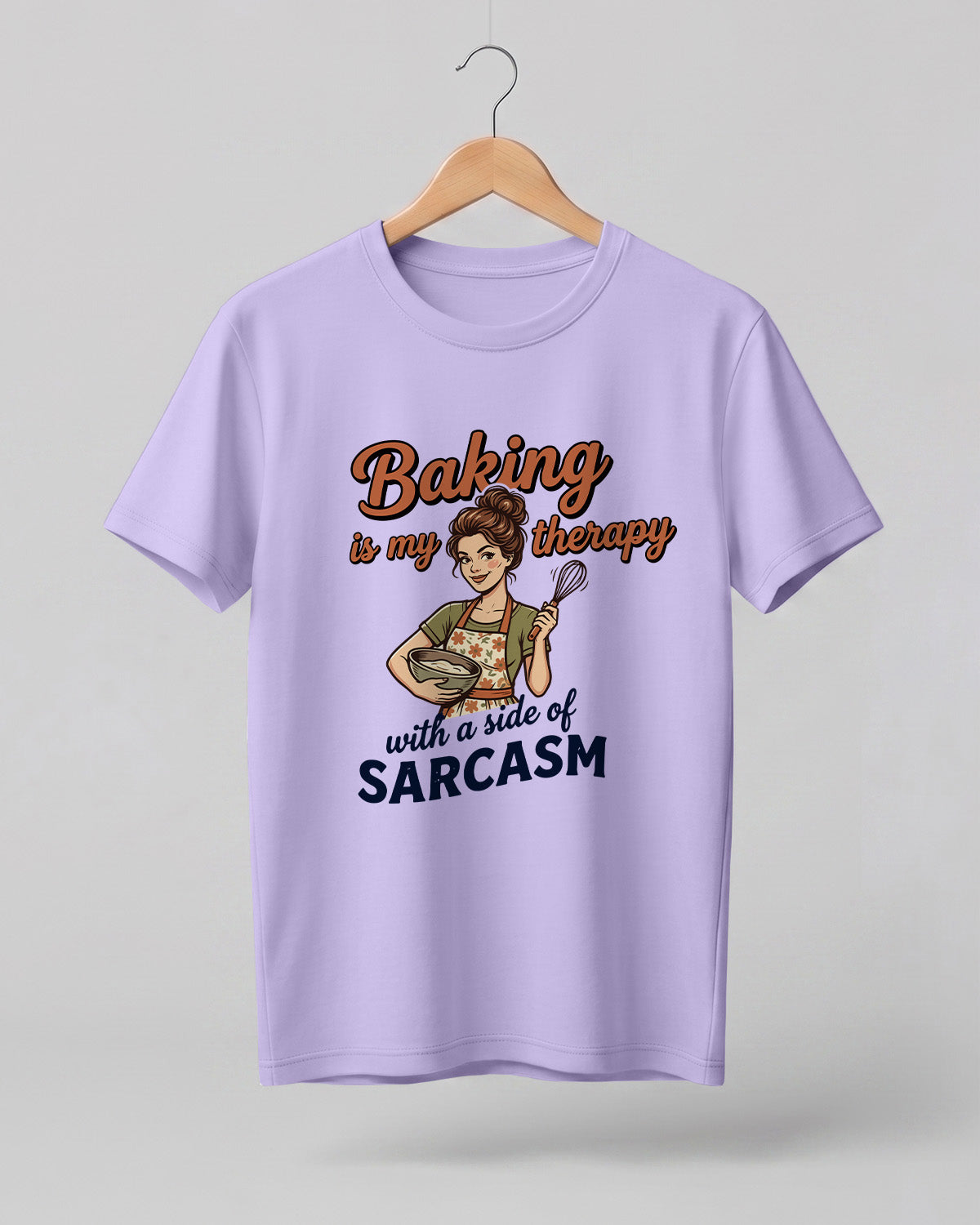 Foodie graphic half sleeve t-shirt featuring cartoon baker illustration with “Baking Is My Therapy with a Side of Sarcasm” typography printed on premium cotton fabric.
