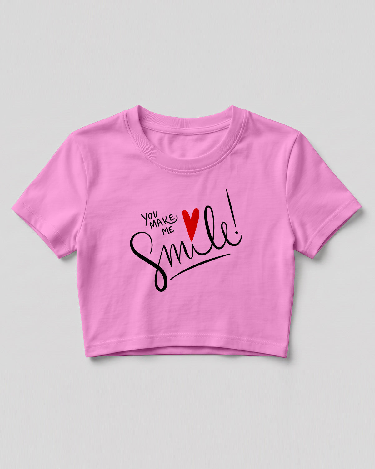 Motivational graphic crop top featuring You Make Me Smile typography design with heart graphic on cotton fabric