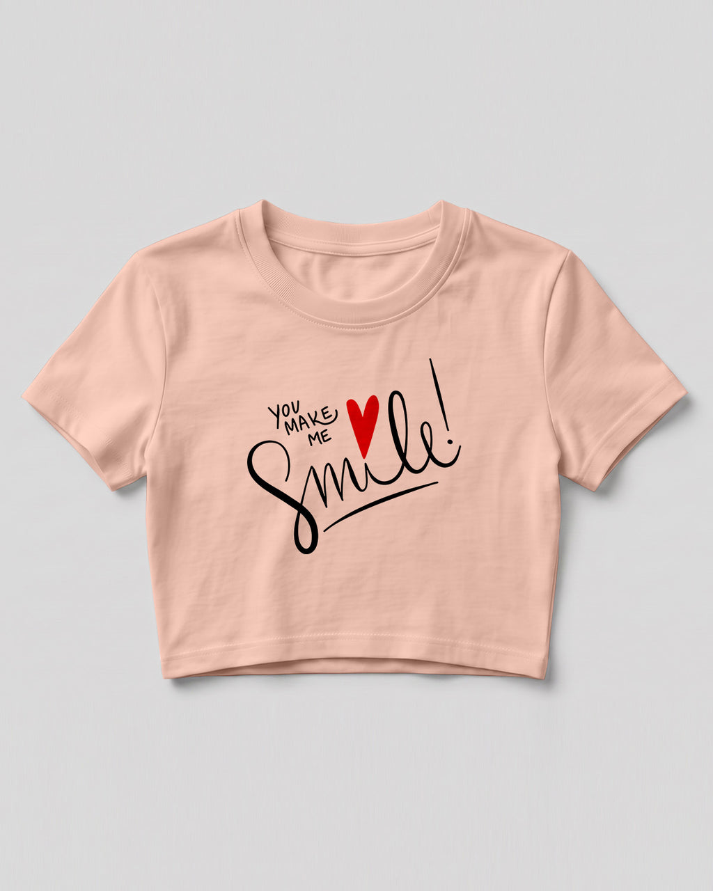 Motivational graphic crop top featuring You Make Me Smile typography design with heart graphic on cotton fabric