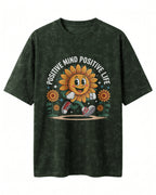 Motivational graphic oversized t-shirt featuring Positive Mind Positive Life typography design on acid washed cotton fabric