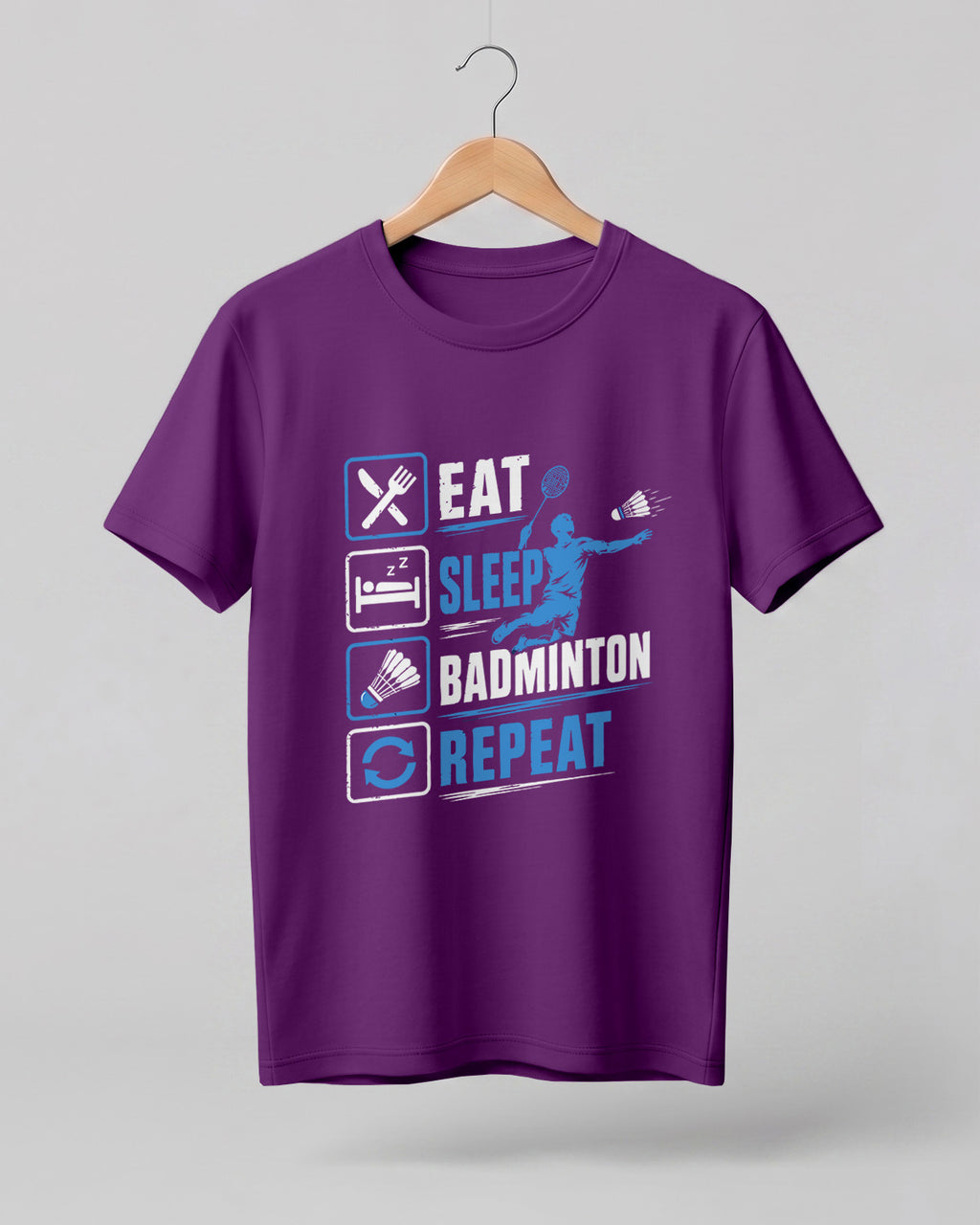 Motivational sports graphic half sleeve t-shirt featuring Eat Sleep Badminton Repeat typography with icons printed on premium cotton fabric.
