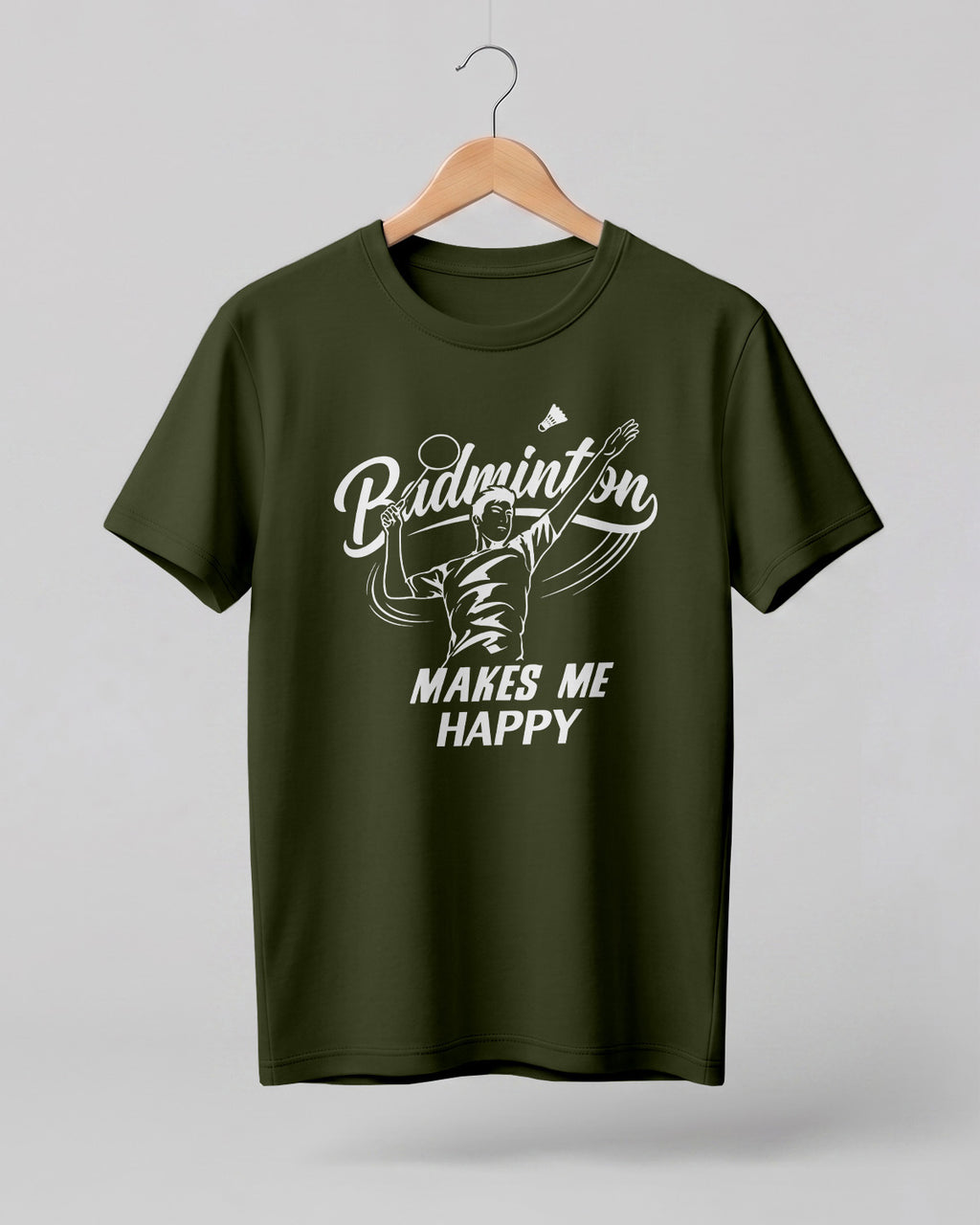 Motivational sports graphic half sleeve t-shirt featuring “Badminton Makes Me Happy” typography with badminton player illustration printed on premium cotton fabric.