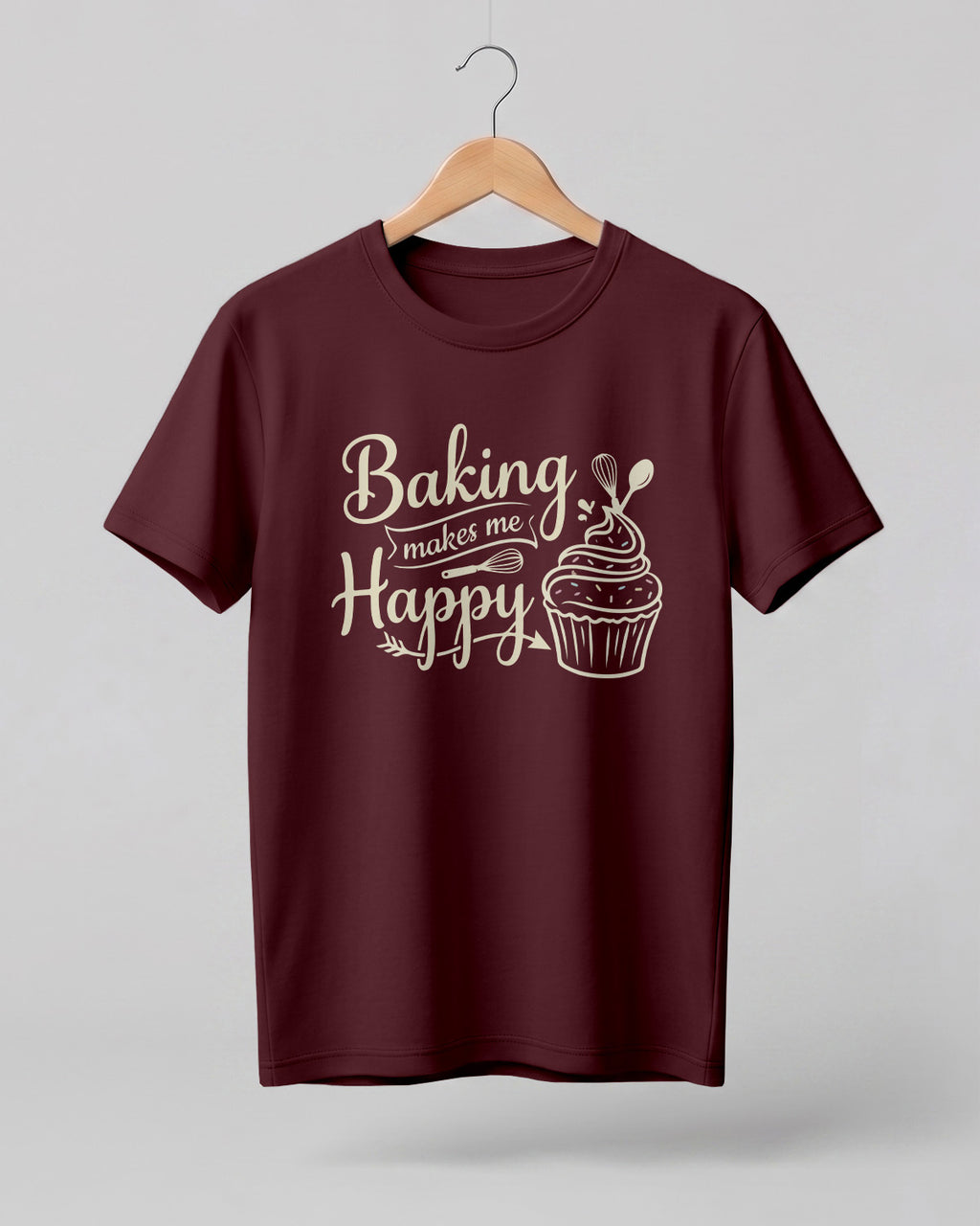 Foodie graphic half sleeve t-shirt featuring “Baking Makes Me Happy” typography with cupcake and whisk illustration printed on premium cotton fabric.