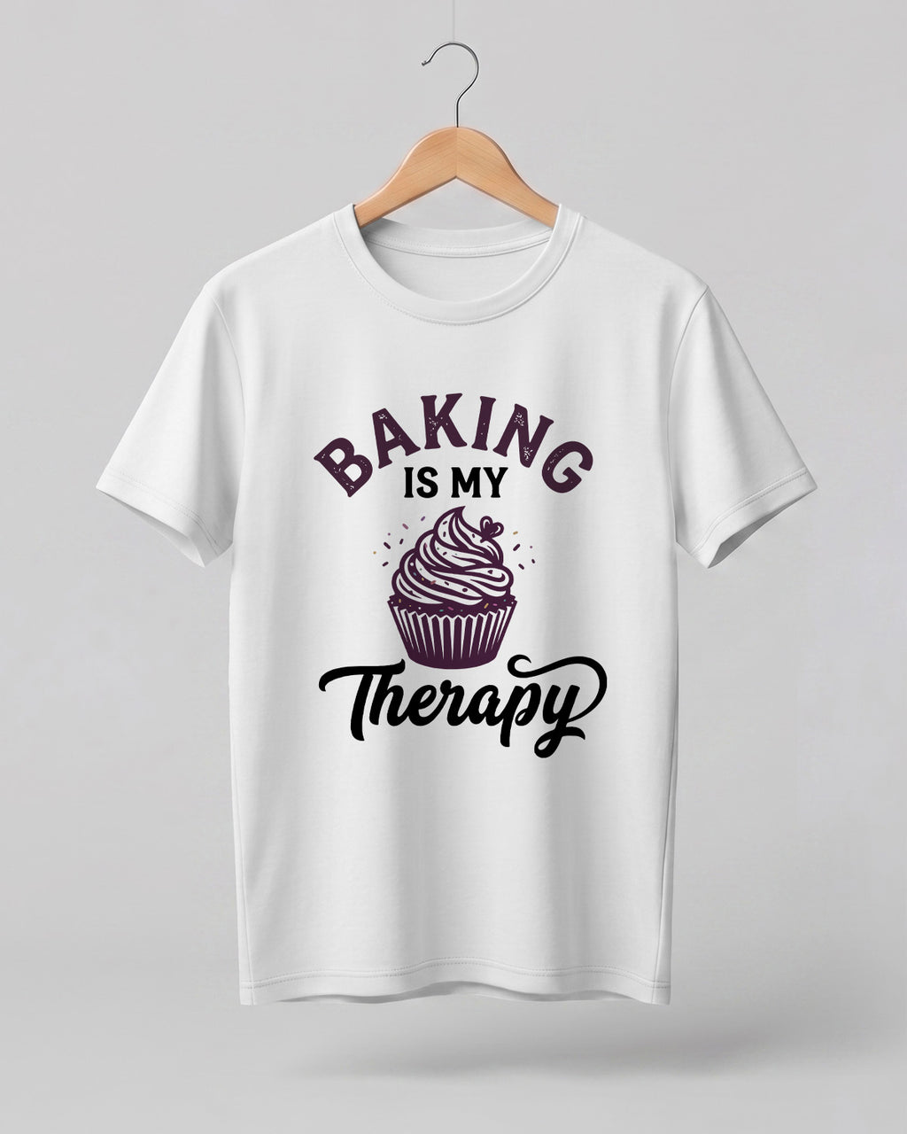 Foodie graphic half sleeve t-shirt featuring “Baking Is My Therapy” typography with cupcake illustration printed on premium cotton fabric.