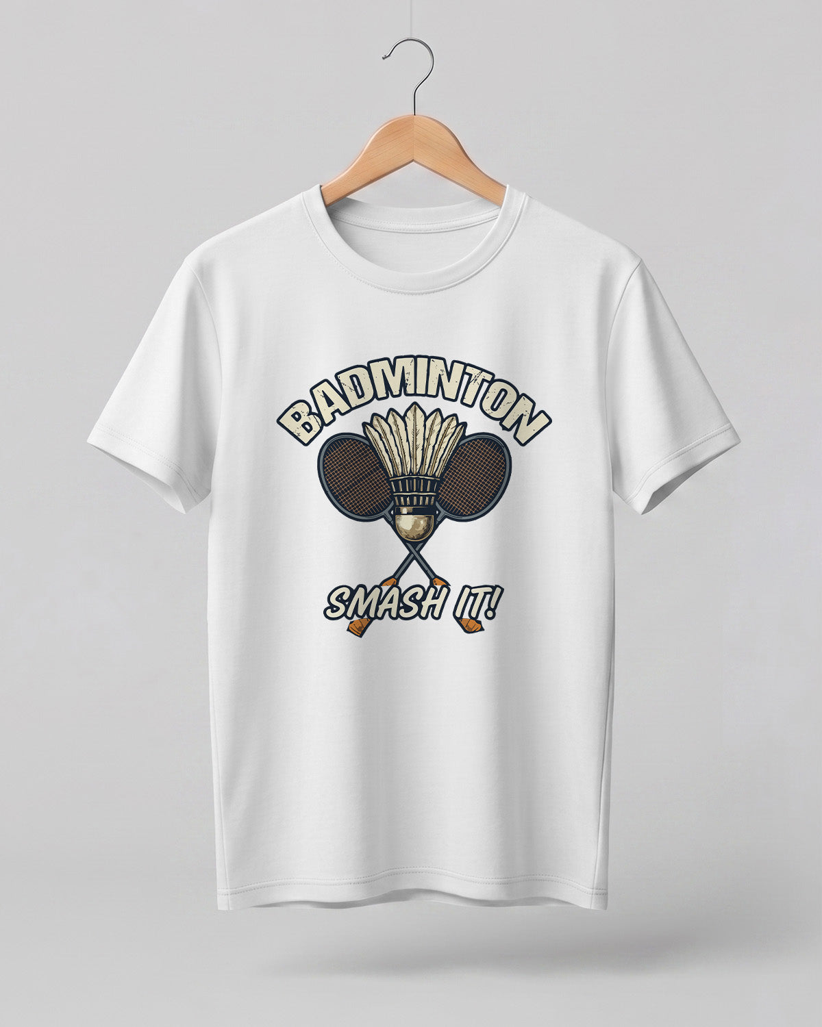 Motivational sports graphic half sleeve t-shirt featuring “Badminton Smash It!” typography with crossed racket and shuttlecock design printed on premium cotton fabric.