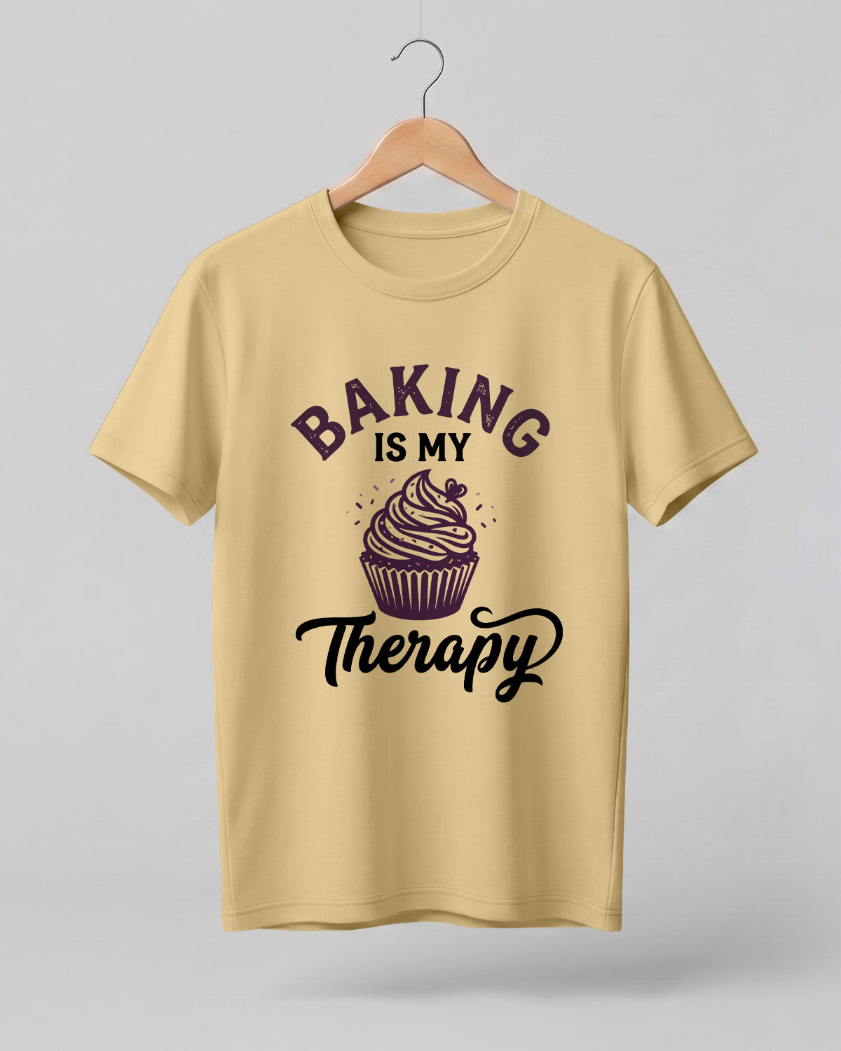 Foodie graphic half sleeve t-shirt featuring “Baking Is My Therapy” typography with cupcake illustration printed on premium cotton fabric.