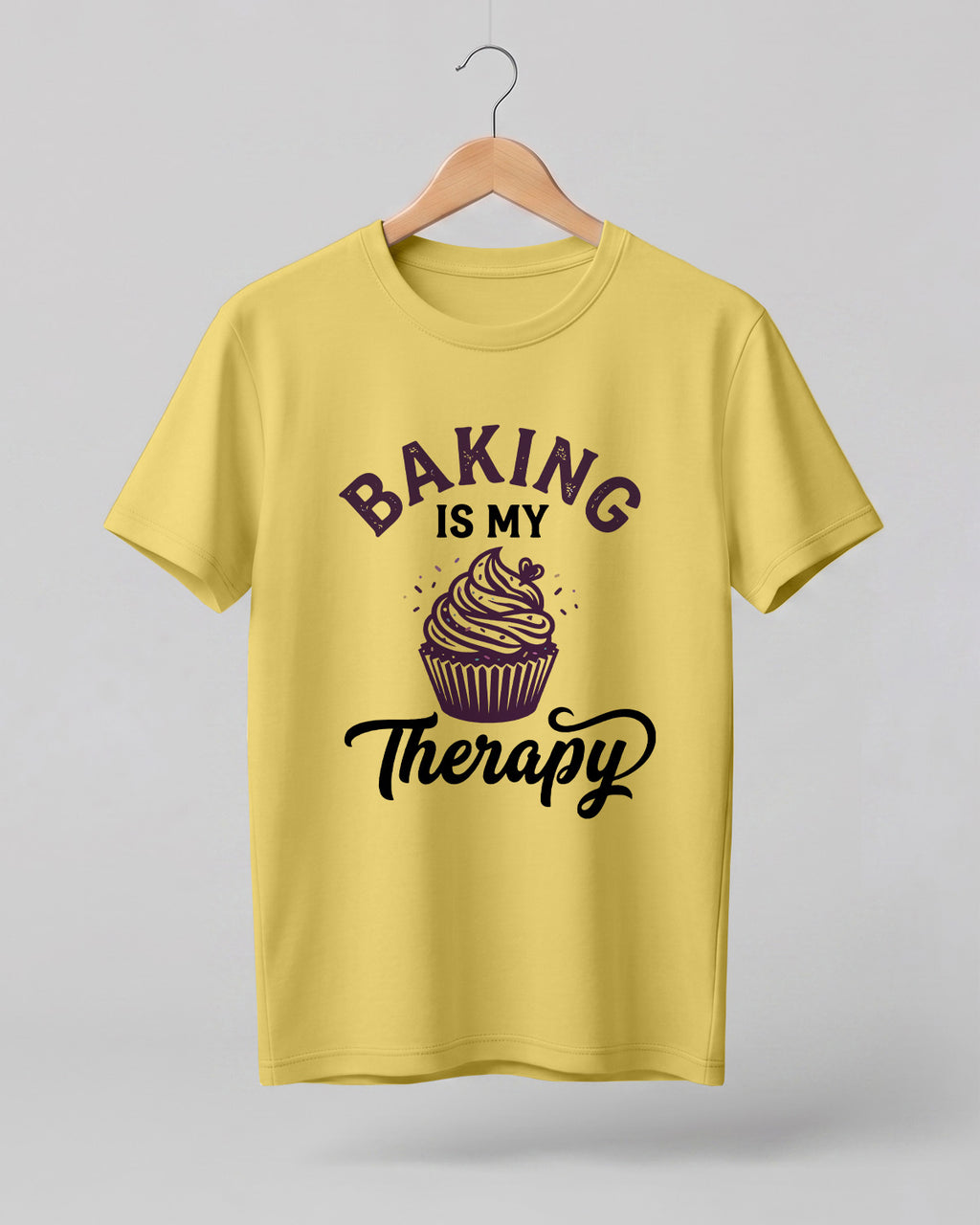 Foodie graphic half sleeve t-shirt featuring “Baking Is My Therapy” typography with cupcake illustration printed on premium cotton fabric.