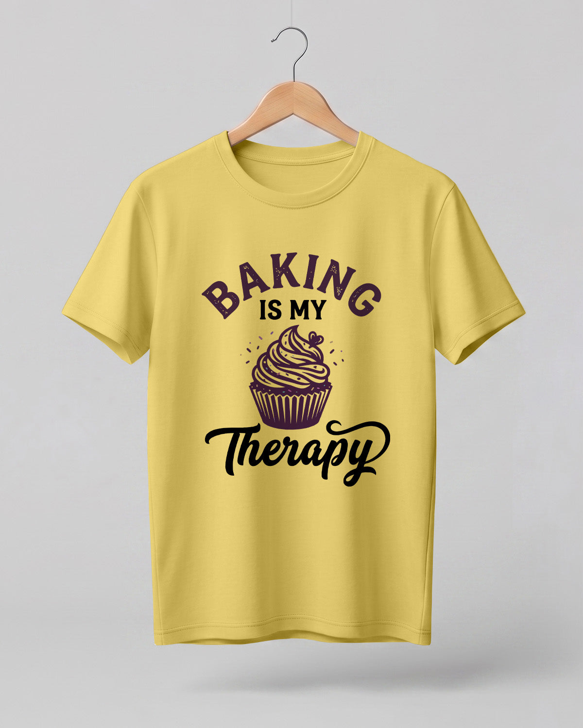 Foodie graphic half sleeve t-shirt featuring “Baking Is My Therapy” typography with cupcake illustration printed on premium cotton fabric.