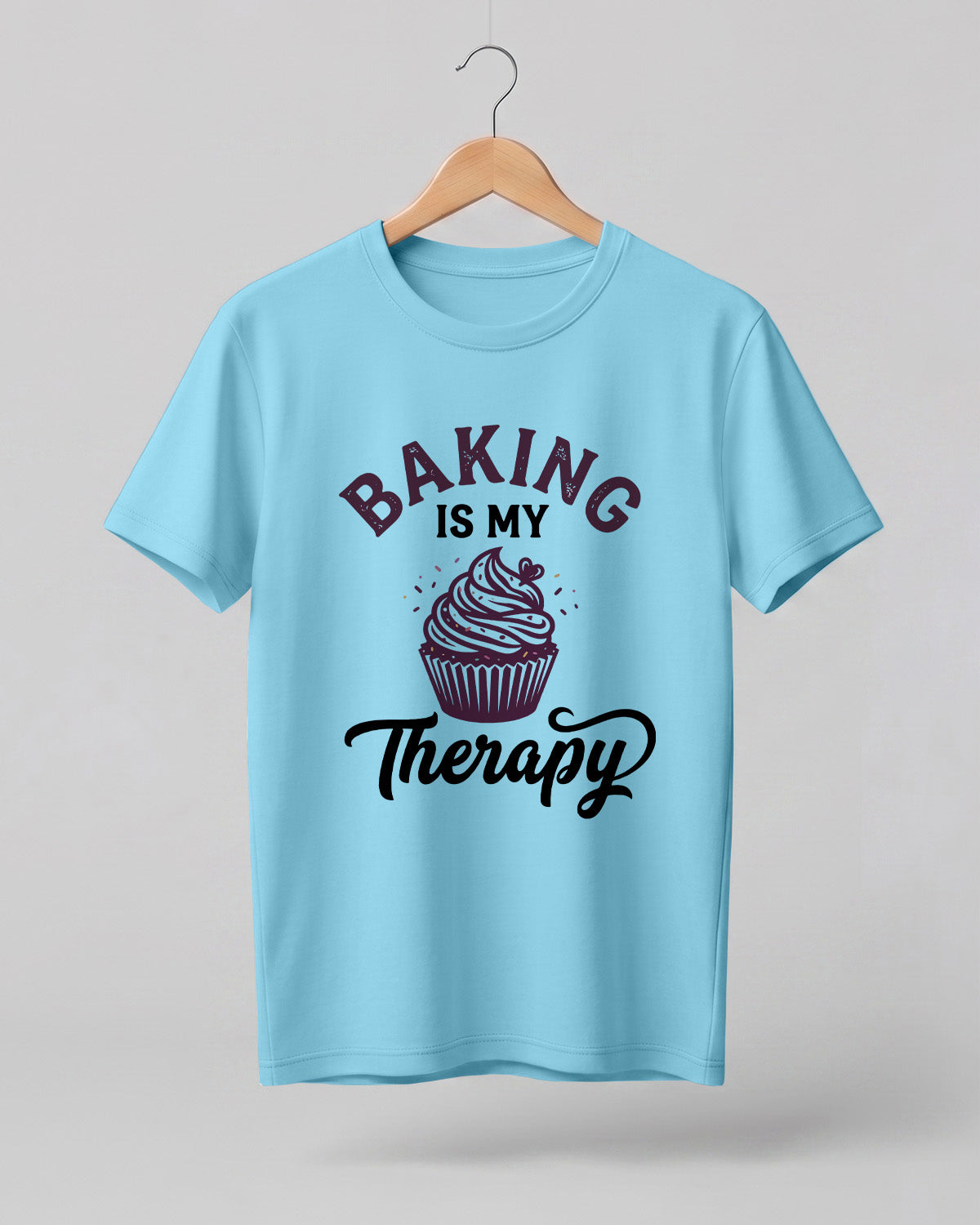 Foodie graphic half sleeve t-shirt featuring “Baking Is My Therapy” typography with cupcake illustration printed on premium cotton fabric.