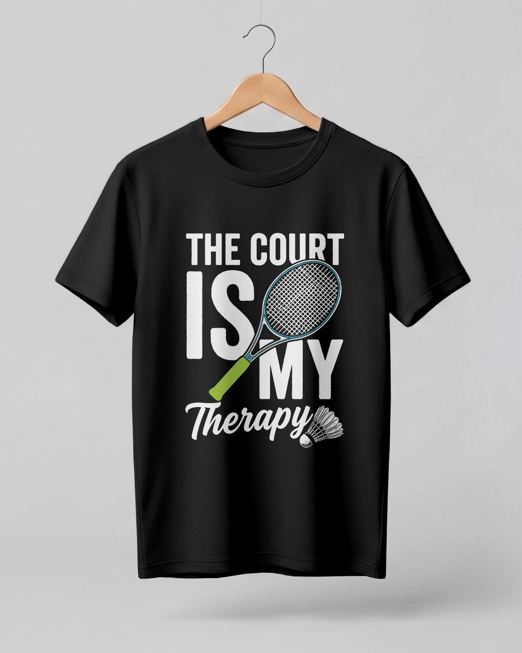 Motivational sports graphic half sleeve t-shirt featuring “The Court Is My Therapy” typography with badminton racket and shuttlecock design printed on premium cotton fabric.