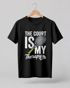 Motivational sports graphic half sleeve t-shirt featuring “The Court Is My Therapy” typography with badminton racket and shuttlecock design printed on premium cotton fabric.