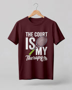 Motivational sports graphic half sleeve t-shirt featuring “The Court Is My Therapy” typography with badminton racket and shuttlecock design printed on premium cotton fabric.