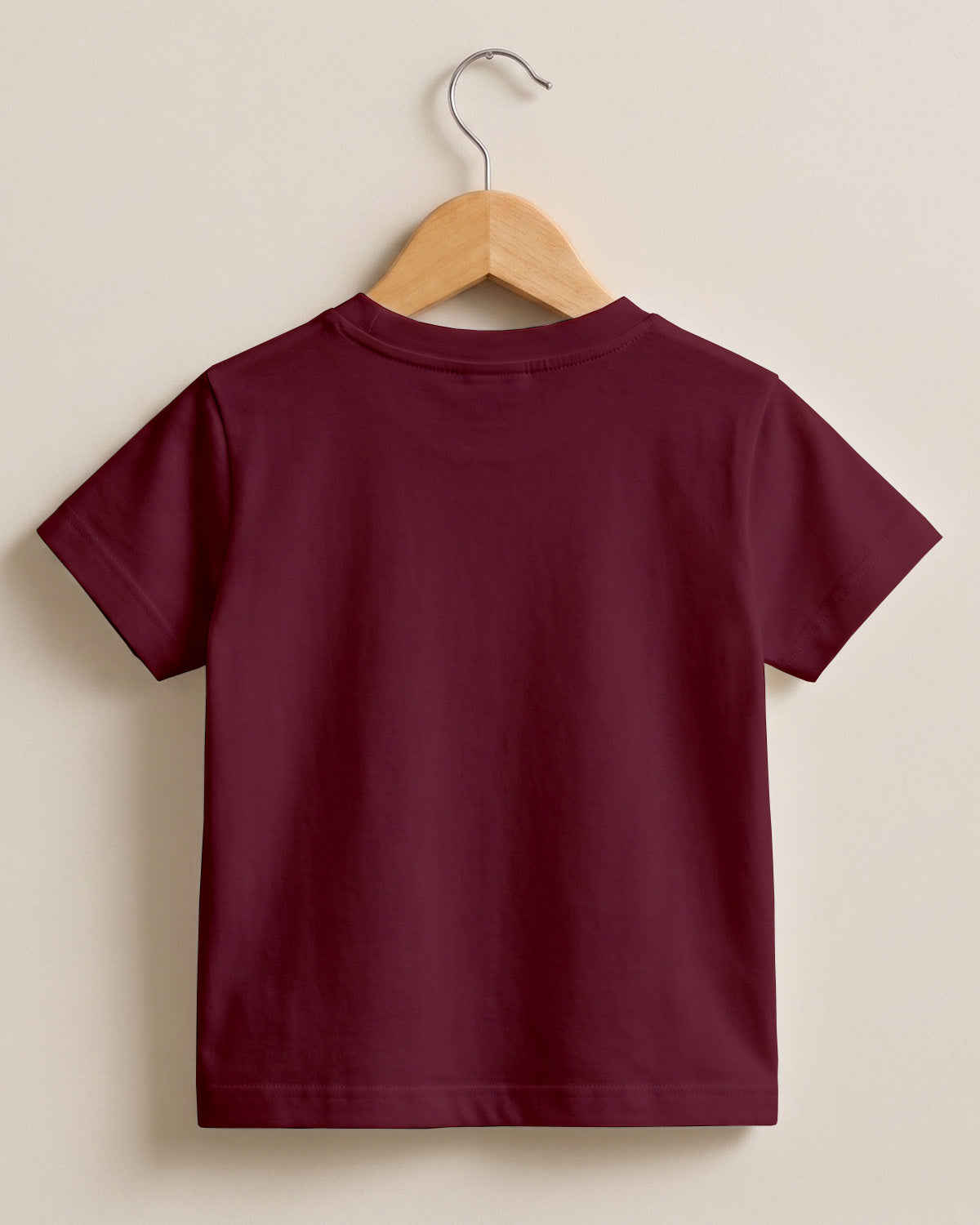 Maroon plain kids half sleeve round neck t-shirt made from premium cotton, 180 GSM yarn, biowashed for softness and durability.