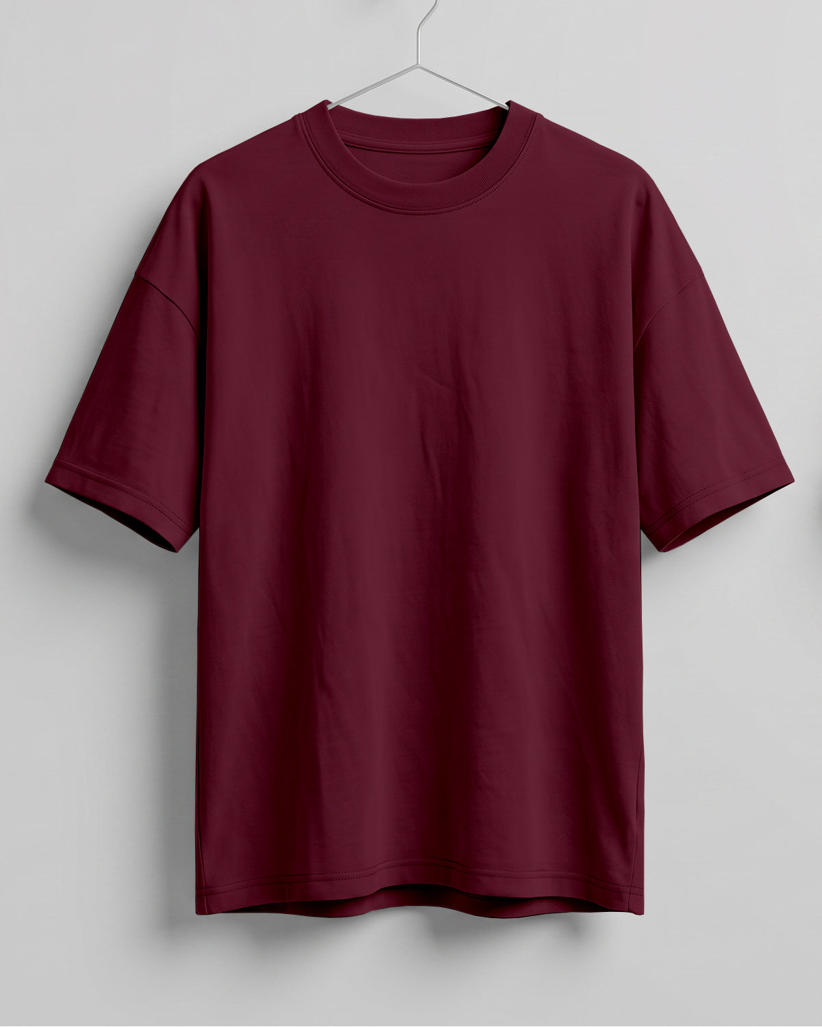 Maroon oversized plain half sleeve round neck t-shirt made from premium cotton 180 GSM red label yarn, biowashed for softness.