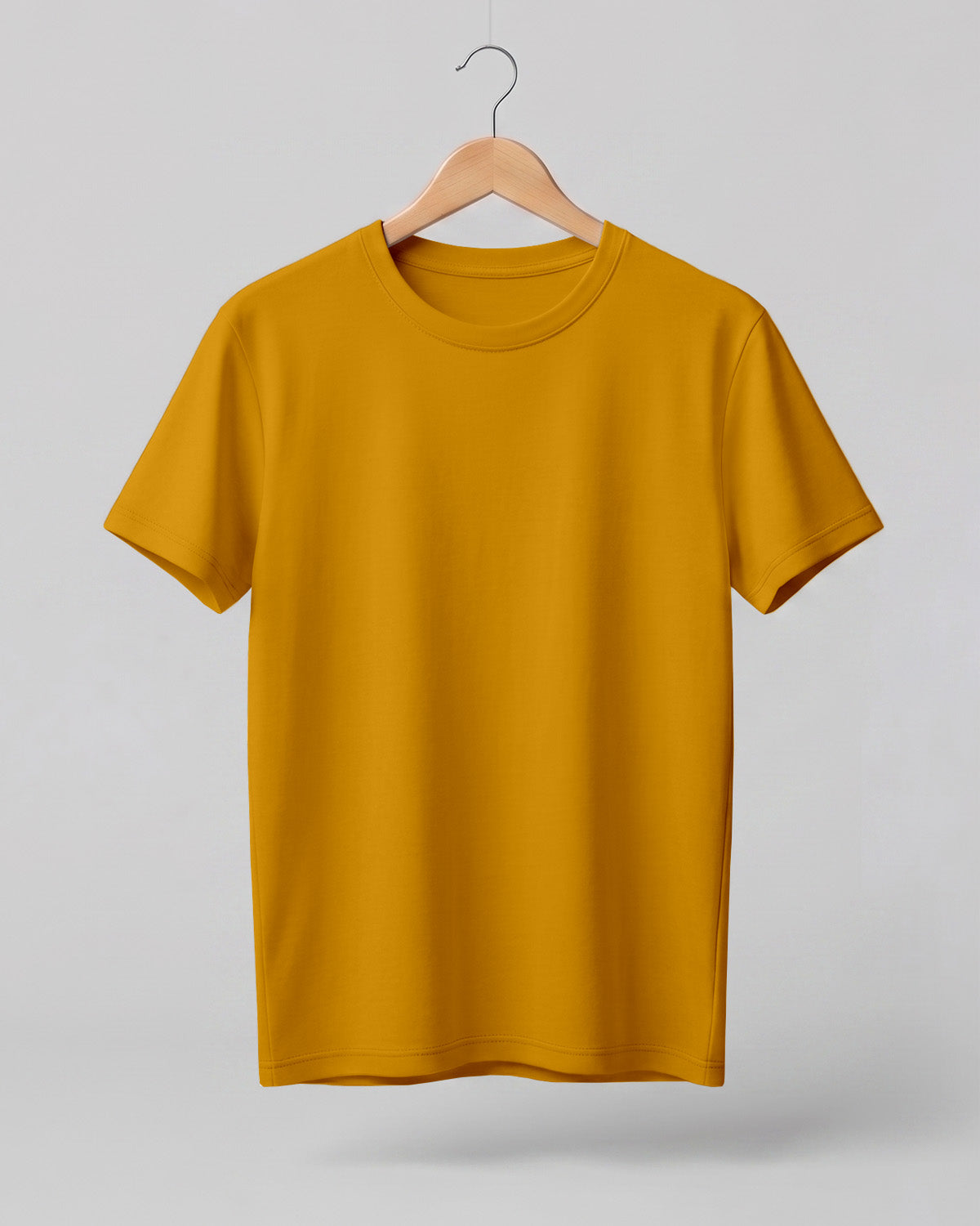 Mustard Yellow plain half sleeve round neck t-shirt made from premium cotton, 180 GSM red label yarn, biowashed for softness and durability.