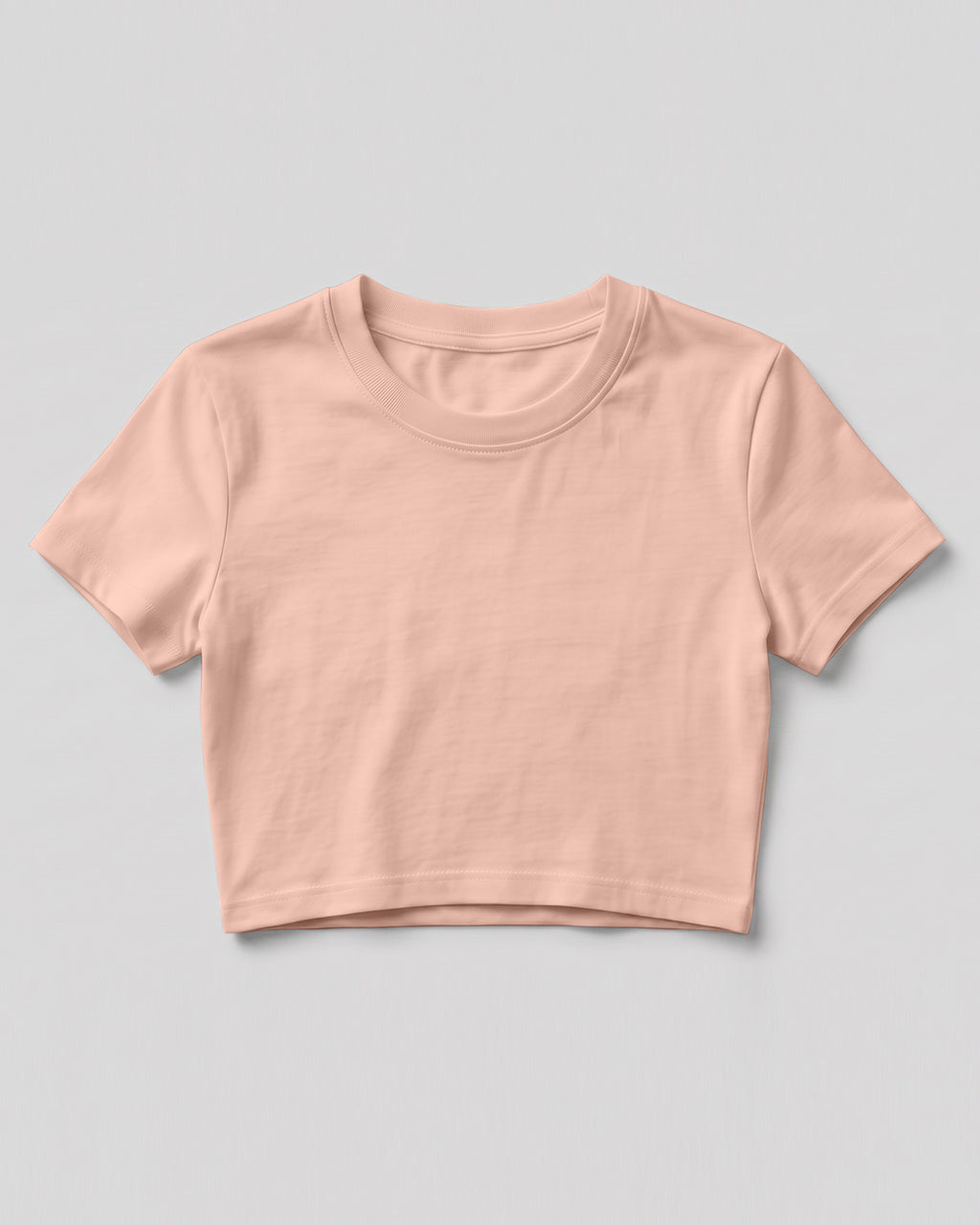 Peach plain cap sleeve crop top made from premium cotton, 180 GSM red label yarn, biowashed for softness and durability.