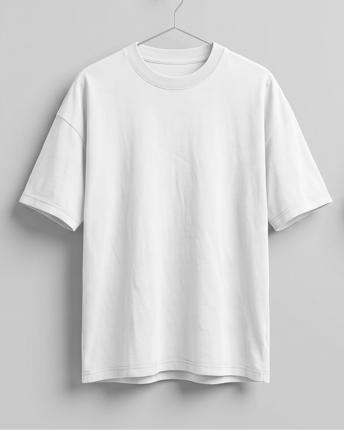 White oversized plain half sleeve round neck t-shirt made from premium cotton 180 GSM red label yarn, biowashed for softness.